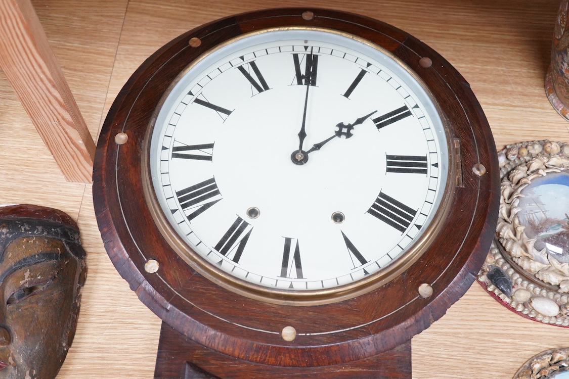 A late 19th century mahogany wall clock with mother of pearl inlaid discs, with pendulum and key, 67cm high